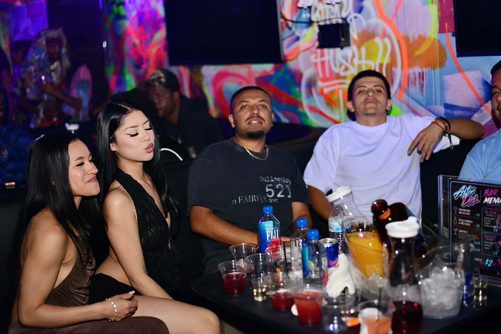 Table with bottle service and the After Dark bar menu